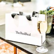 the real real bag and champagne in the realreal store