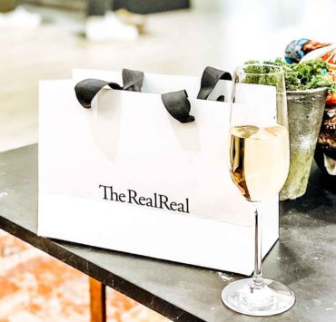 the real real bag and champagne in the realreal store