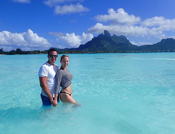 romantic couple water Bora Bora Glamour Gains luxury travel blog