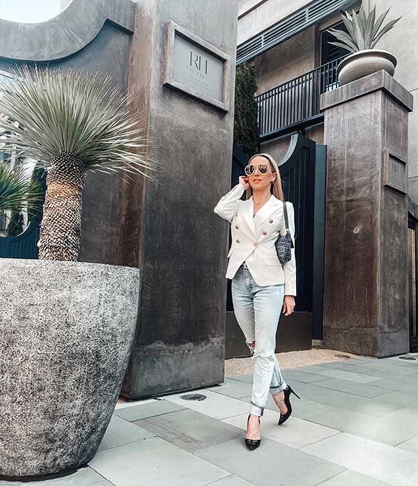white blazer blue jeans outfit