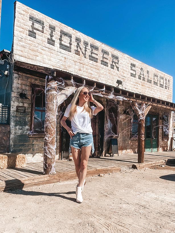styling white boots with jean shorts fashion blogger Glamour Gains Pioneer Saloon