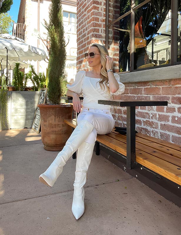 white boots styled white jeans top fashion blogger sat cafe