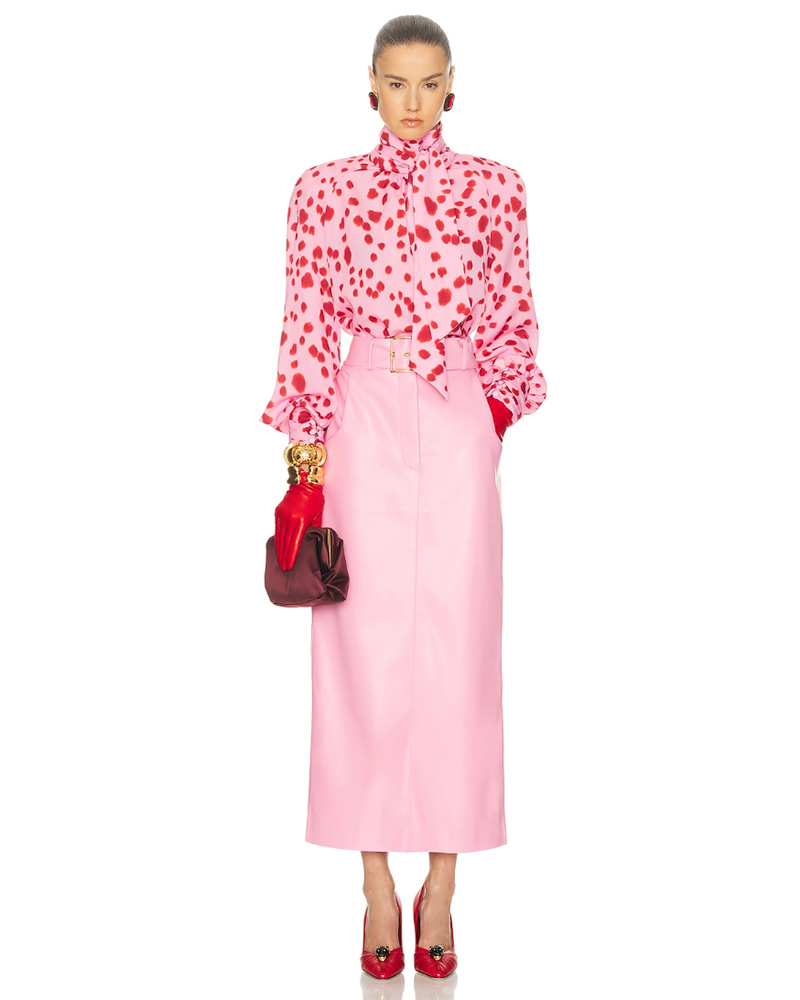 wearable fashion trends 2026 clashing pink skirt, top and red shoes