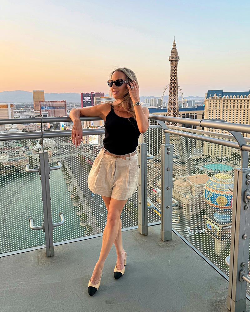 Eve Dawes black tank top tan shorts Chanel Slingbacks