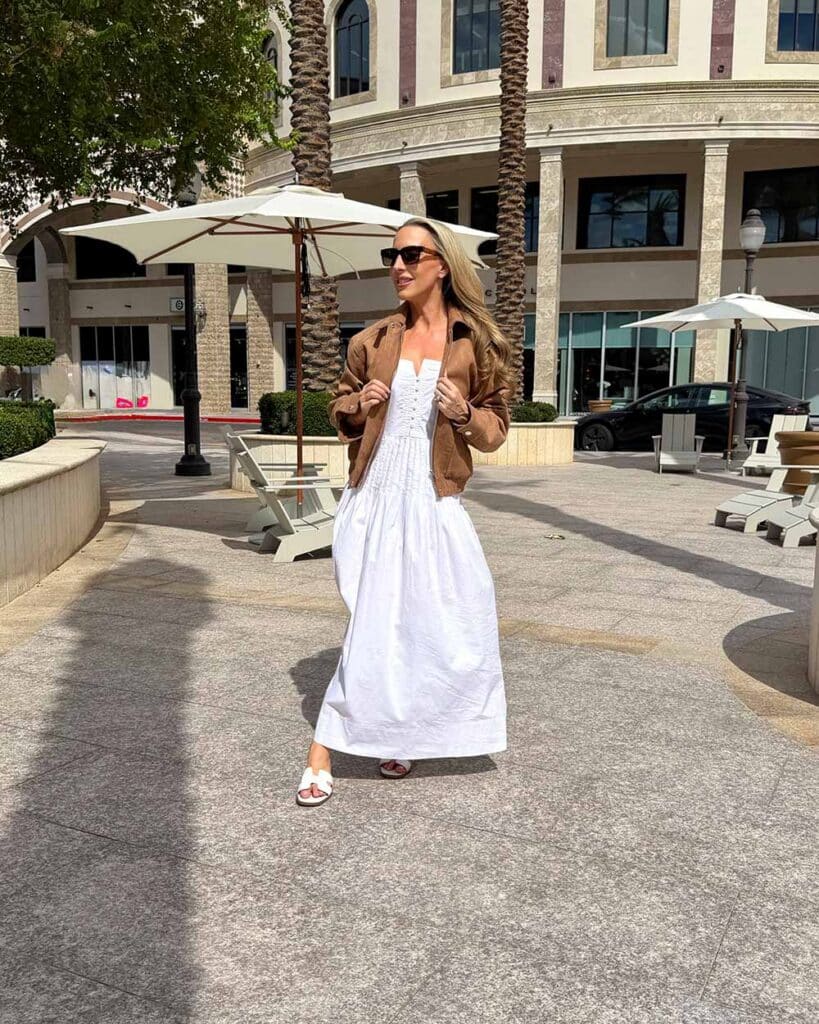 revolve brown suede jacket styled with long white dress