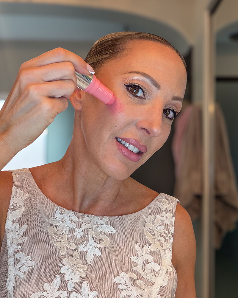 Haus Labs Blush Balm in shade Glassy Pomelo being applied by Eve Dawes