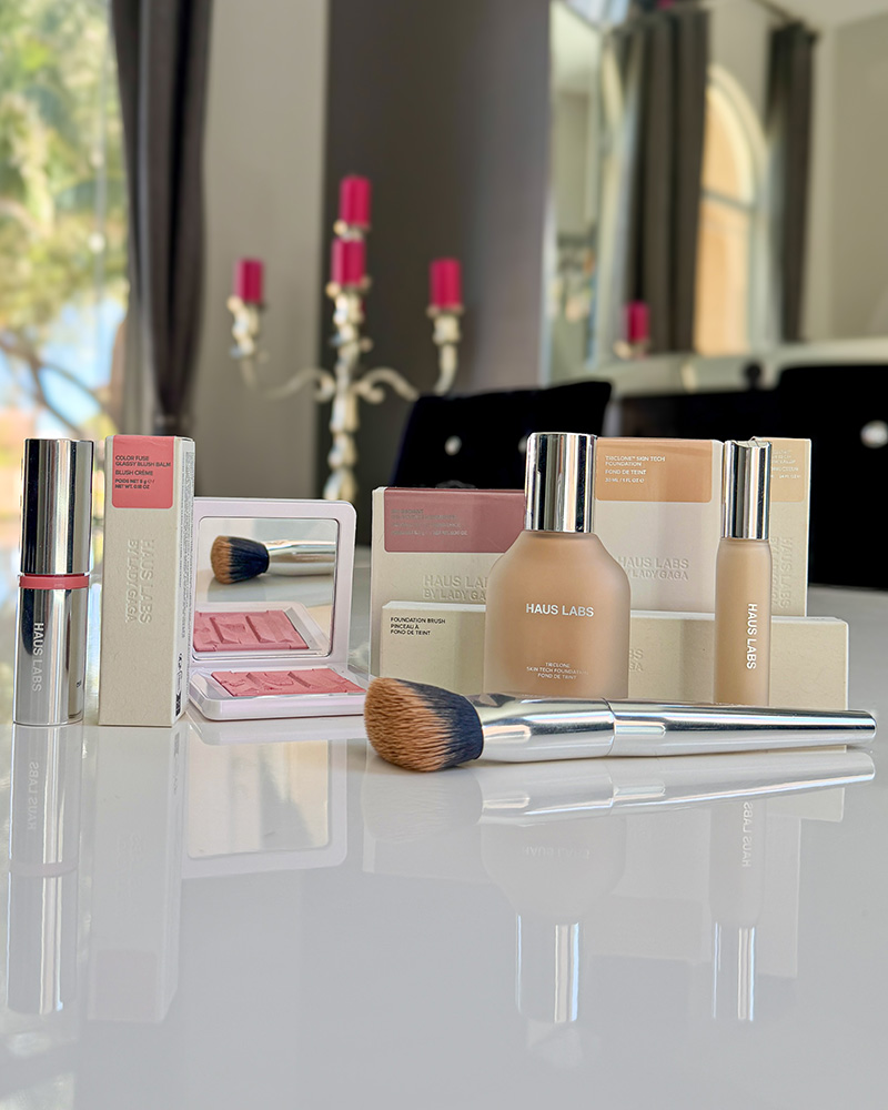 Haus Labs makeup review blush, foundation, concealer, foundation brush and highlighter on a white table