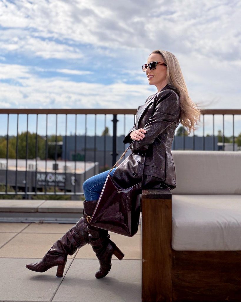 revolve brown leather jacket styled with skinny jeans and knee high boots