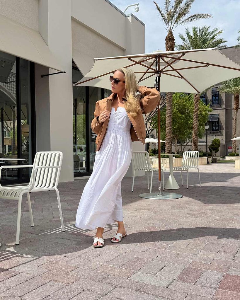 vicci eyewear for women worn by Eve Dawes with white dress and brown jacket